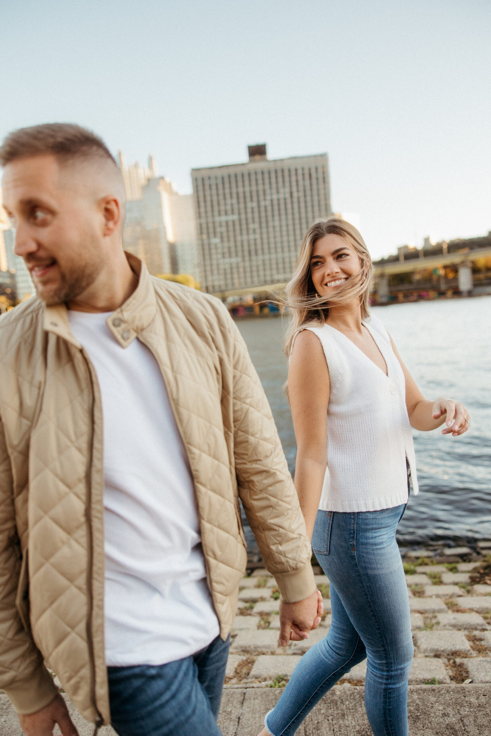 Romantic portraits with Pittsburgh skyline during North Shore engagement photos