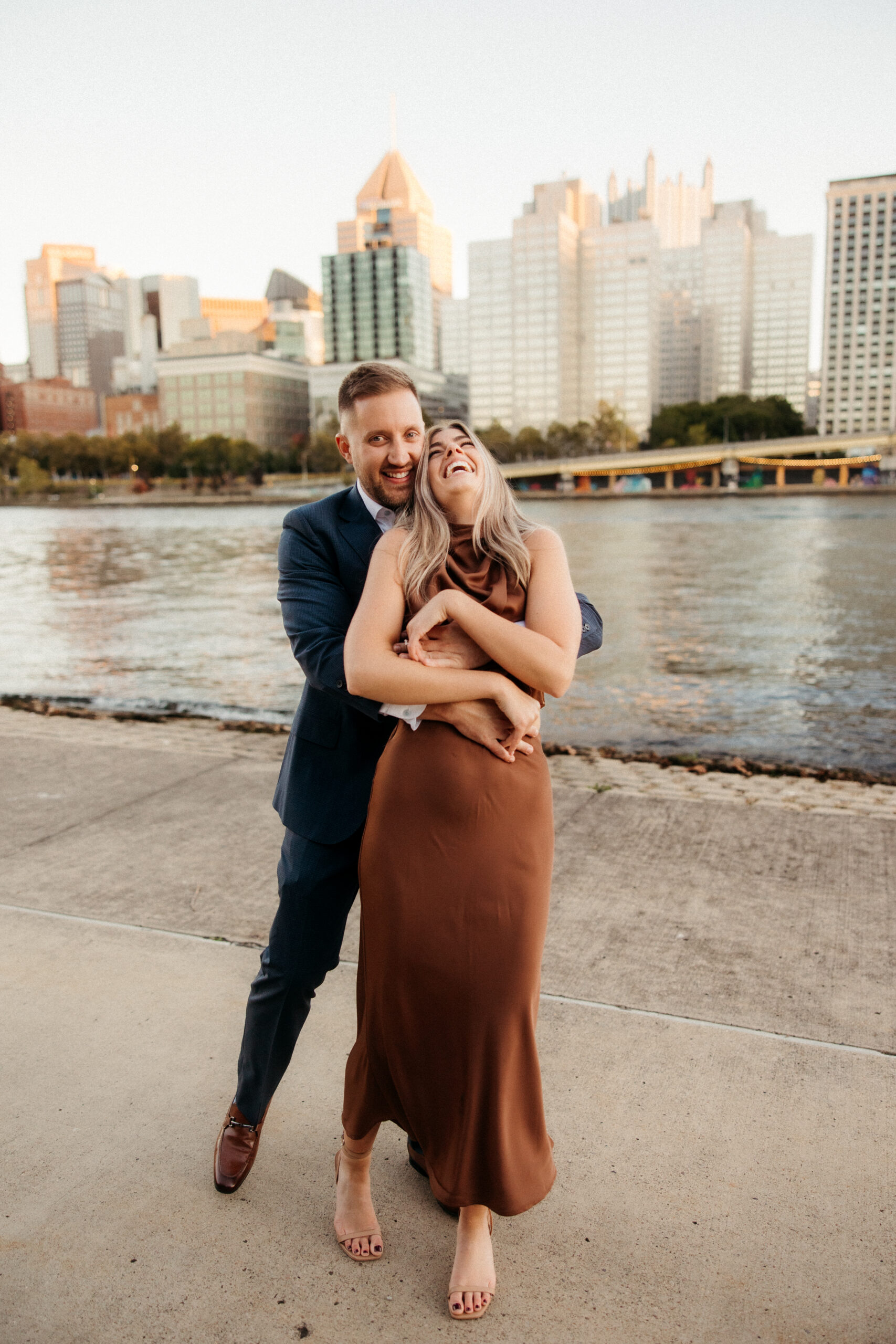 Romantic portraits with Pittsburgh skyline during North Shore engagement photos