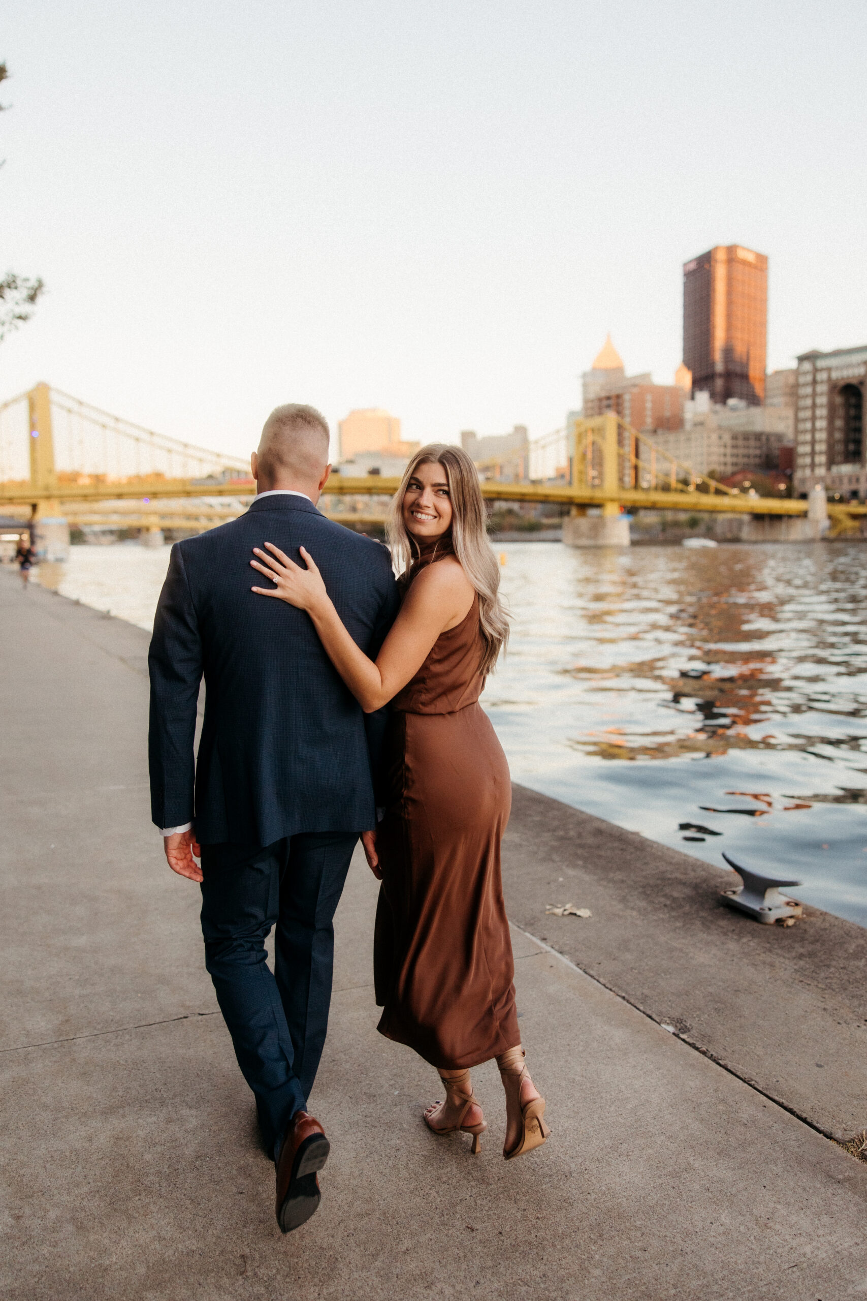 Romantic portraits with Pittsburgh skyline during North Shore engagement photos