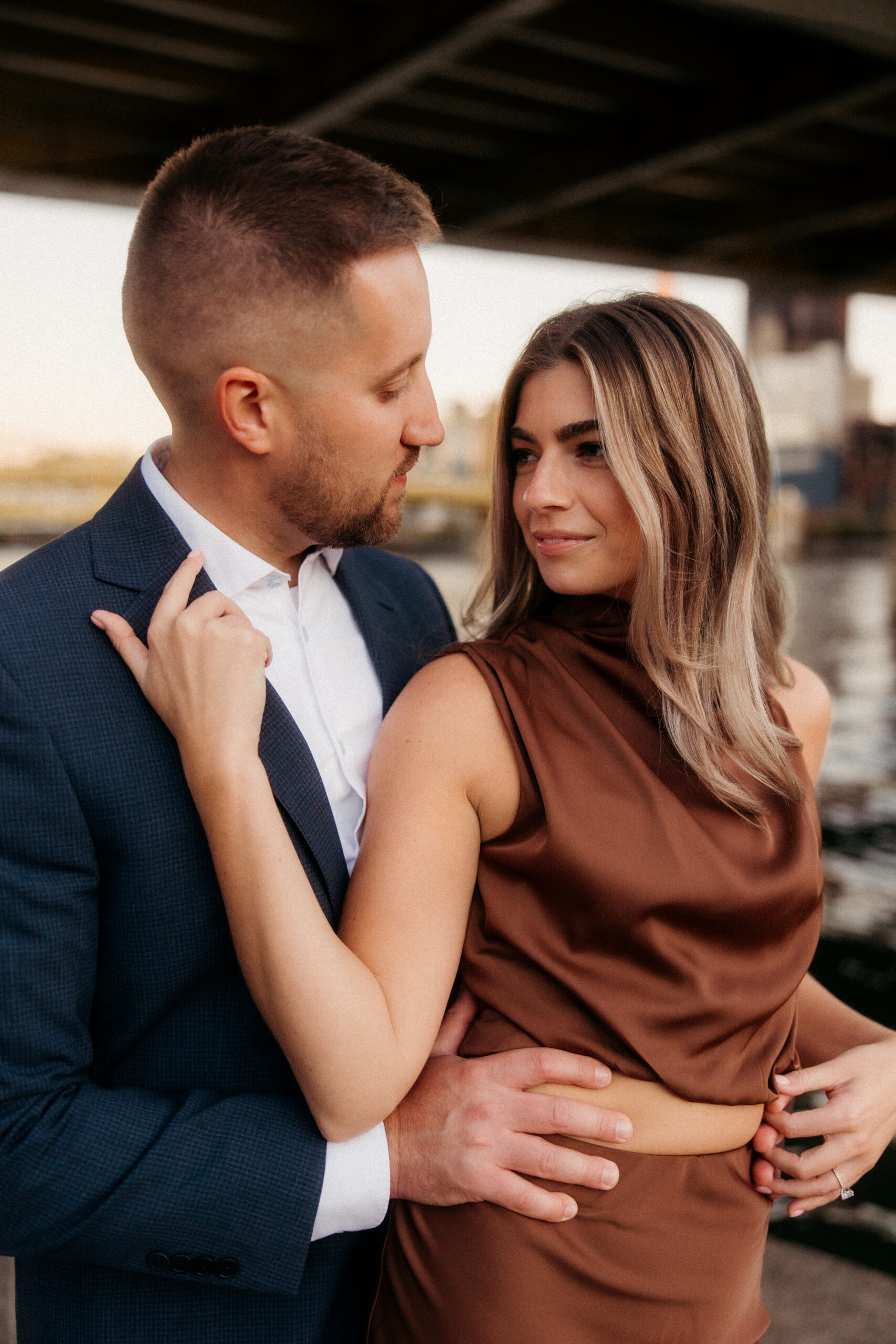 Romantic portraits with Pittsburgh skyline during North Shore engagement photos