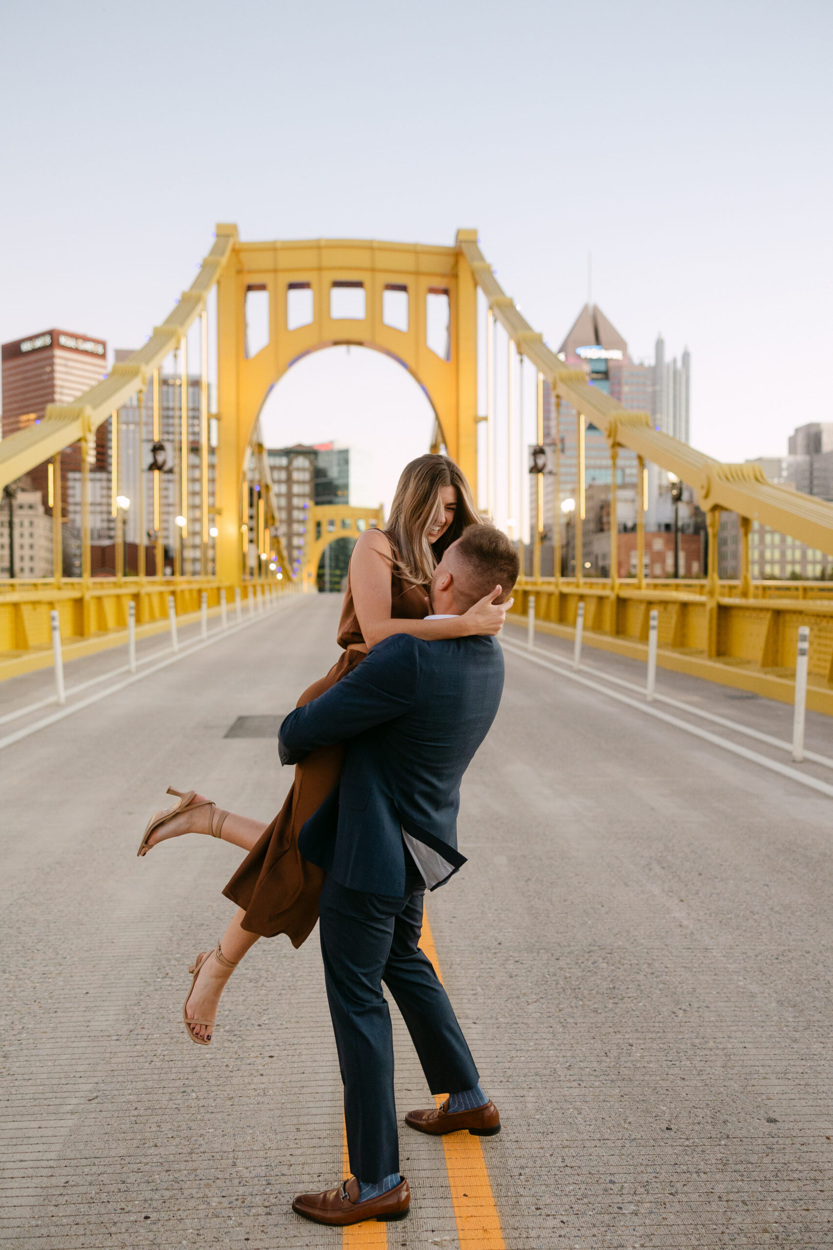 Romantic portraits with Pittsburgh skyline during North Shore engagement photos