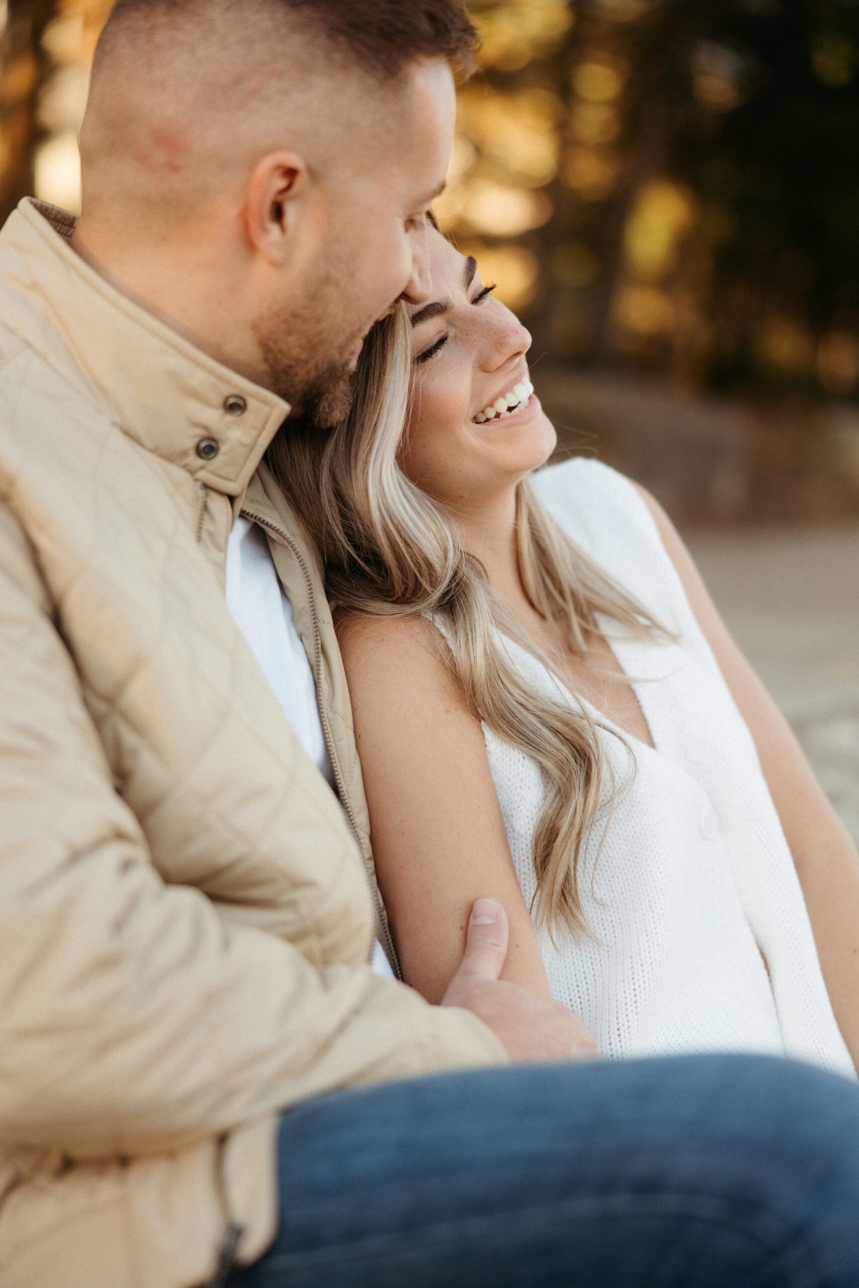 Romantic portraits with Pittsburgh skyline during North Shore engagement photos